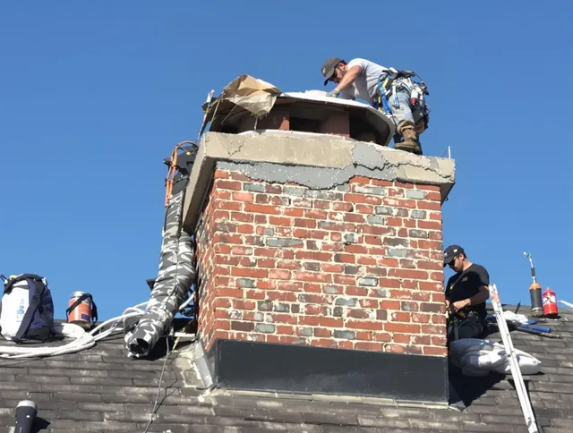 Norwich Chimney Sweep installing a custom chimney crown in Norwich, CT