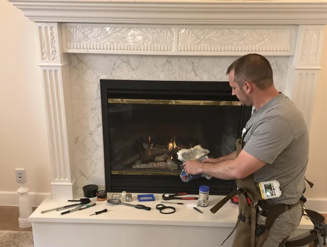 Norwich Chimney Sweep performing fireplace maintenance in Norwich, CT